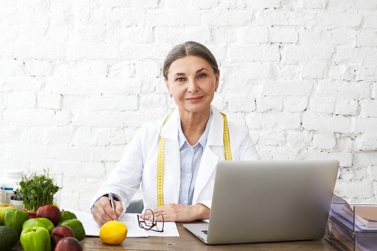 Smiling nutrition advisor at her desk